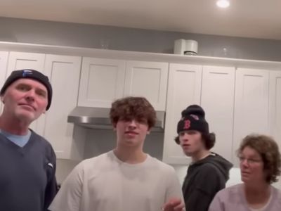 Chris Sturniolo is standing between Jimmy Sturniolo and MaryLou Carey-Sturniolo.